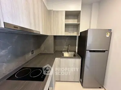 Modern kitchen with sleek cabinetry and stainless steel appliances