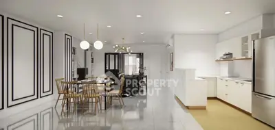 Spacious open-plan living and dining area with modern kitchen and stylish decor.