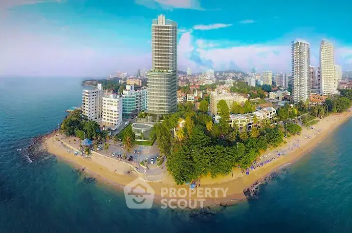 Stunning beachfront high-rise buildings with panoramic ocean views and lush greenery.