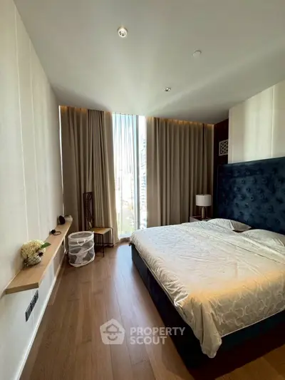 Luxurious bedroom with elegant decor and floor-to-ceiling window view