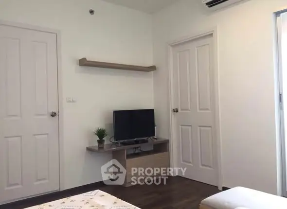 Modern living room with TV and minimalist decor