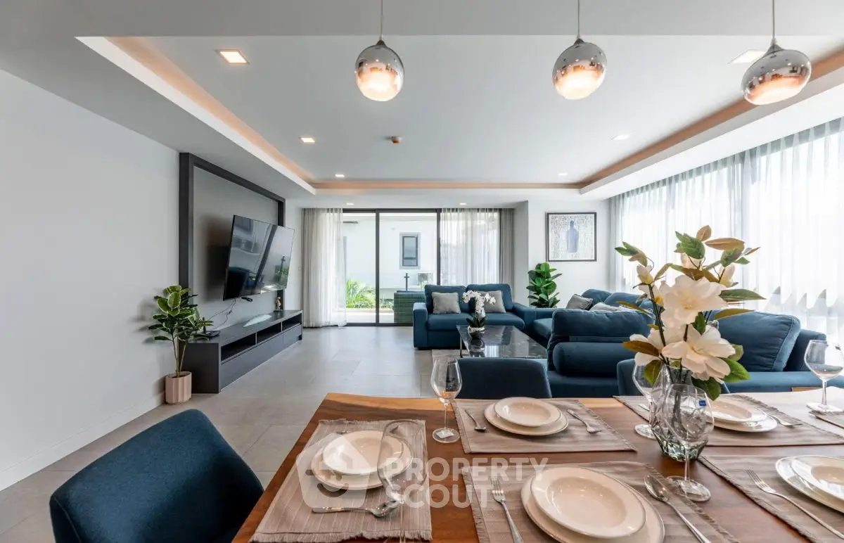 Spacious modern living room with elegant dining area and stylish decor