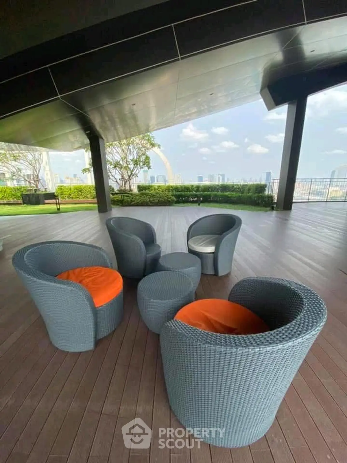 Stunning rooftop terrace with modern seating and panoramic city views, perfect for relaxation and entertainment.