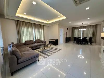 Spacious modern living room with elegant dining area and stylish lighting
