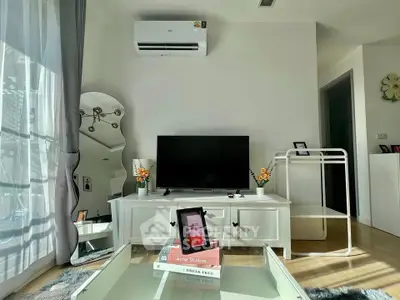 Modern living room with air conditioning, stylish decor, and natural light.