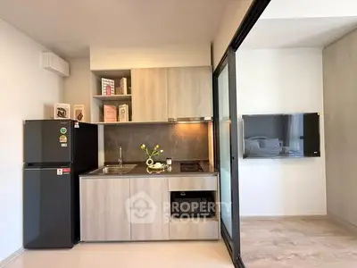 Modern compact kitchen with sleek appliances and open layout