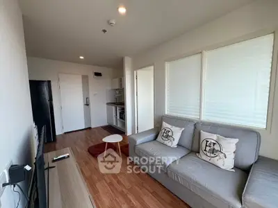 Modern living room with cozy sofa and sleek wooden flooring