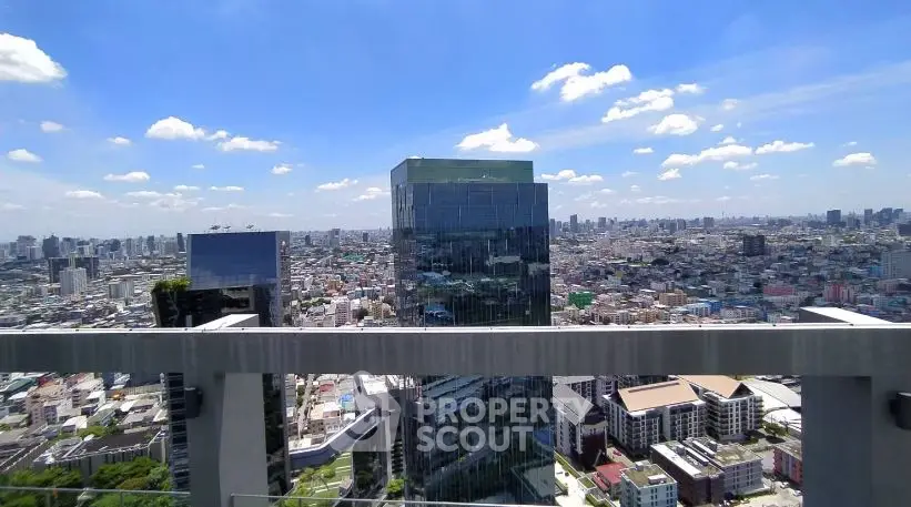 Stunning cityscape view from a high-rise balcony showcasing modern architecture and vibrant skyline.