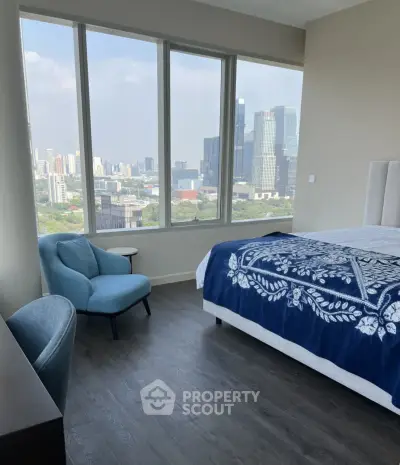 Modern bedroom with stunning city view and elegant decor