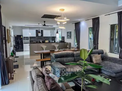 Spacious modern living room with open kitchen and stylish decor