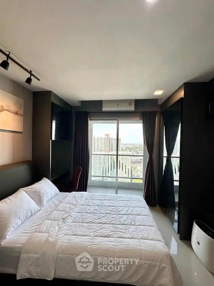 Luxurious bedroom with stunning city view and modern decor