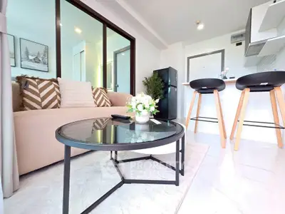 Modern living room with stylish decor and open kitchen layout