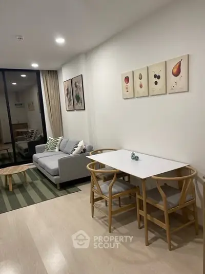 Modern living room with stylish decor and cozy seating area, perfect for relaxation and entertaining.