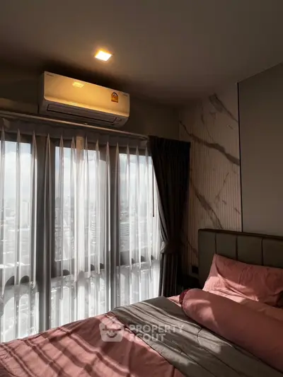 Cozy bedroom with city view and modern decor