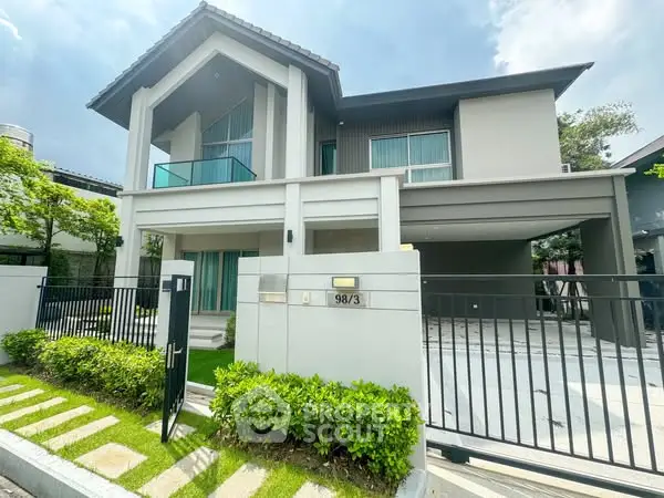 Modern two-story house with sleek design and spacious driveway