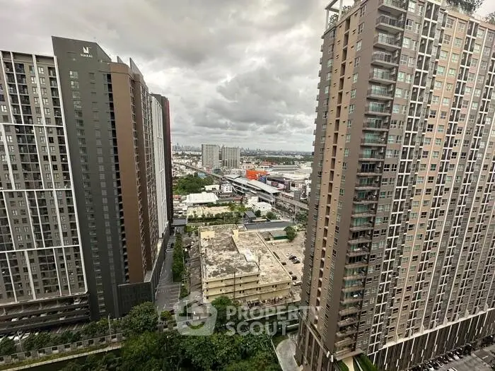 Stunning high-rise apartment buildings with cityscape view, perfect for urban living enthusiasts.