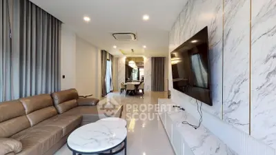 Luxurious modern living room with marble accents and spacious seating area