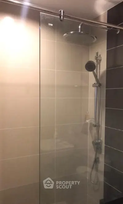 Modern bathroom with sleek glass shower and rainfall showerhead
