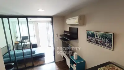 Modern living room with glass partition and air conditioning in stylish apartment