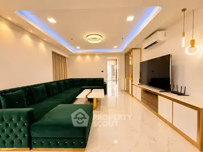 Luxurious modern living room with elegant green sofa and sleek entertainment center