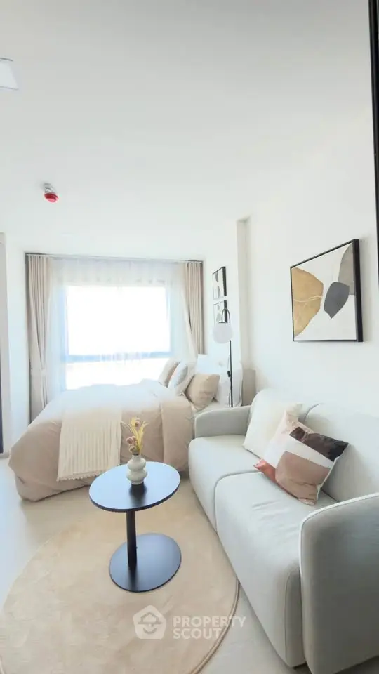 Modern studio apartment with cozy living area and stylish decor