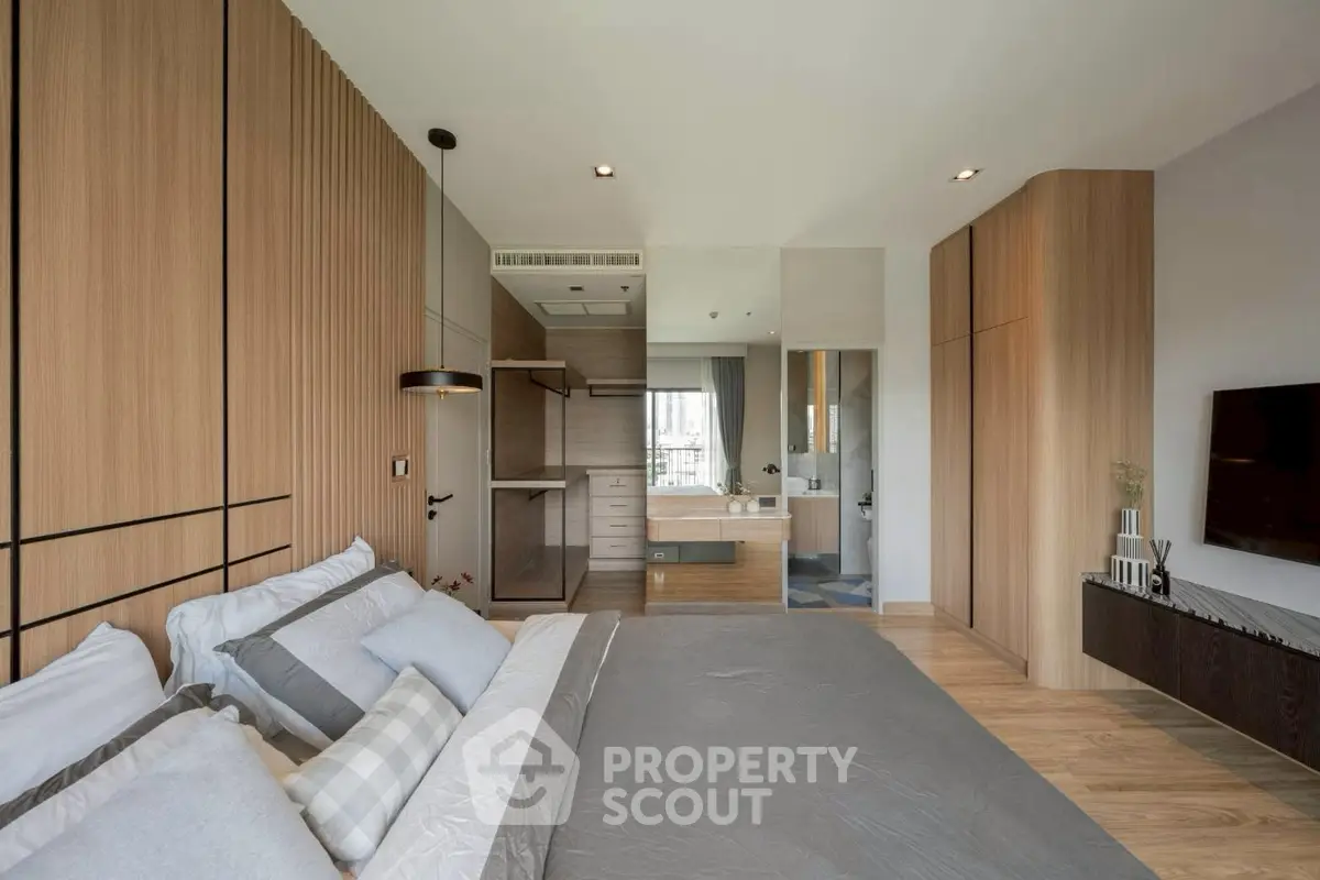 Luxurious modern bedroom with elegant wood paneling and sleek decor