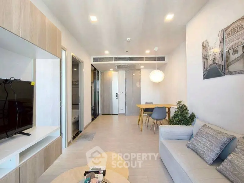 Modern living room with sleek furniture and open layout, perfect for contemporary living.