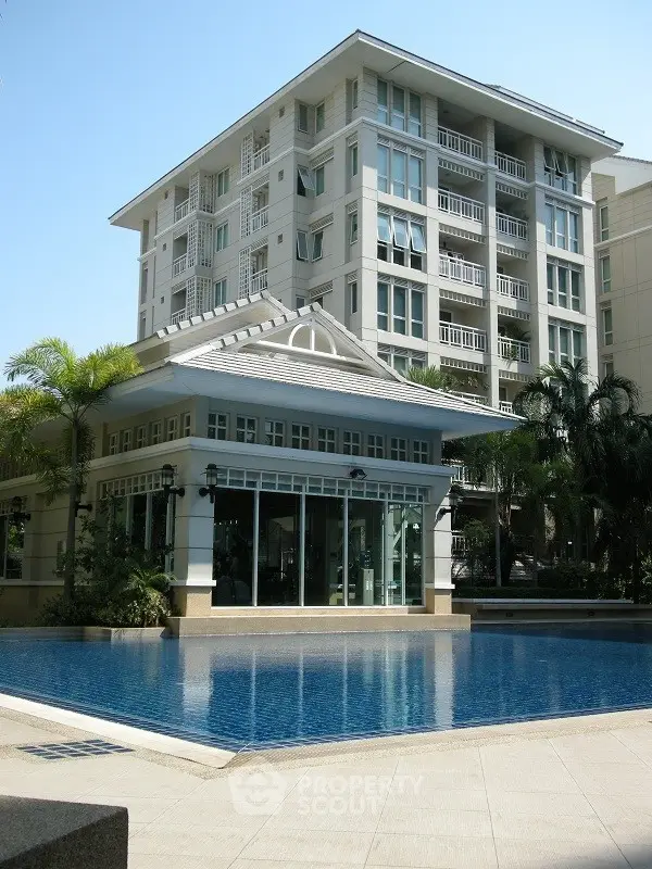 Luxurious condominium with poolside view and modern architecture