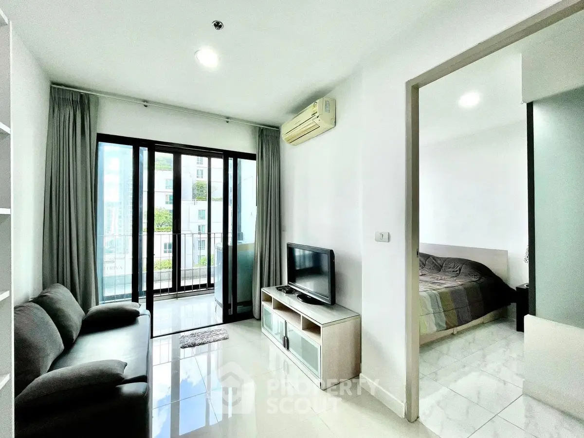 Modern apartment living room with balcony and bedroom view