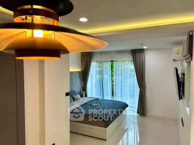 Modern bedroom with elegant lighting and large window view