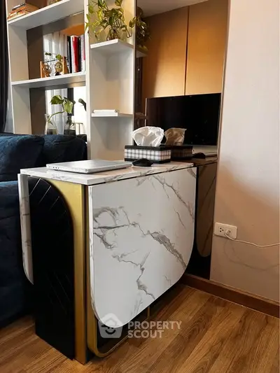 Modern living room with stylish marble table and elegant shelving unit