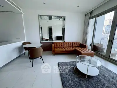Modern living room with brown leather sofa and city view balcony