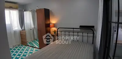 Cozy bedroom with stylish metal bed frame and modern wardrobe