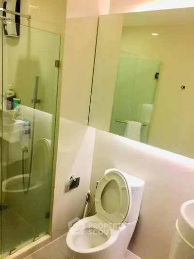 Modern bathroom with glass shower and sleek fixtures