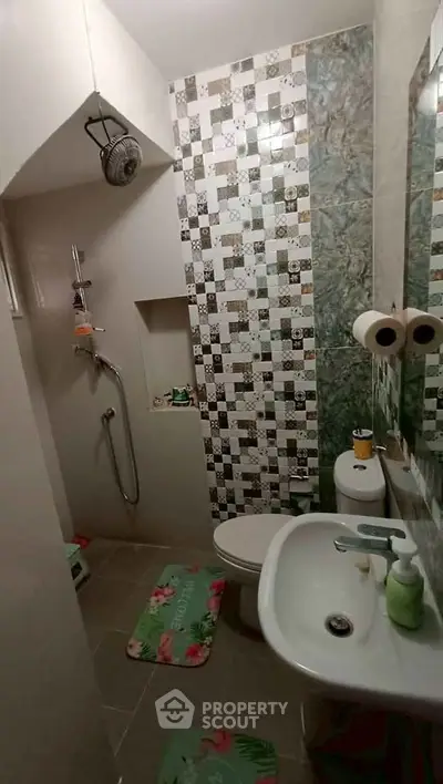 Charming bathroom with modern shower and stylish tile accents