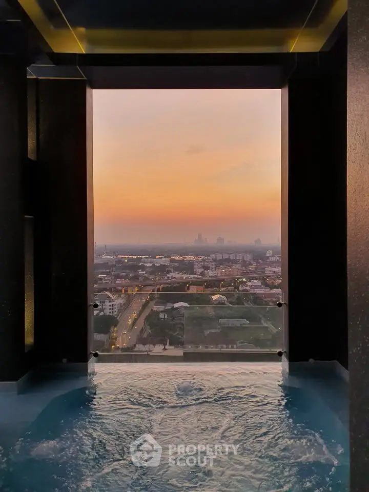 Stunning high-rise pool with breathtaking cityscape sunset view, perfect for luxury living.