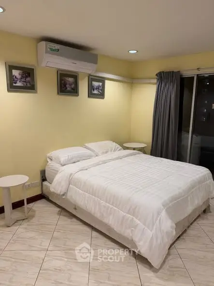 Cozy bedroom with air conditioning and modern decor in a stylish apartment.