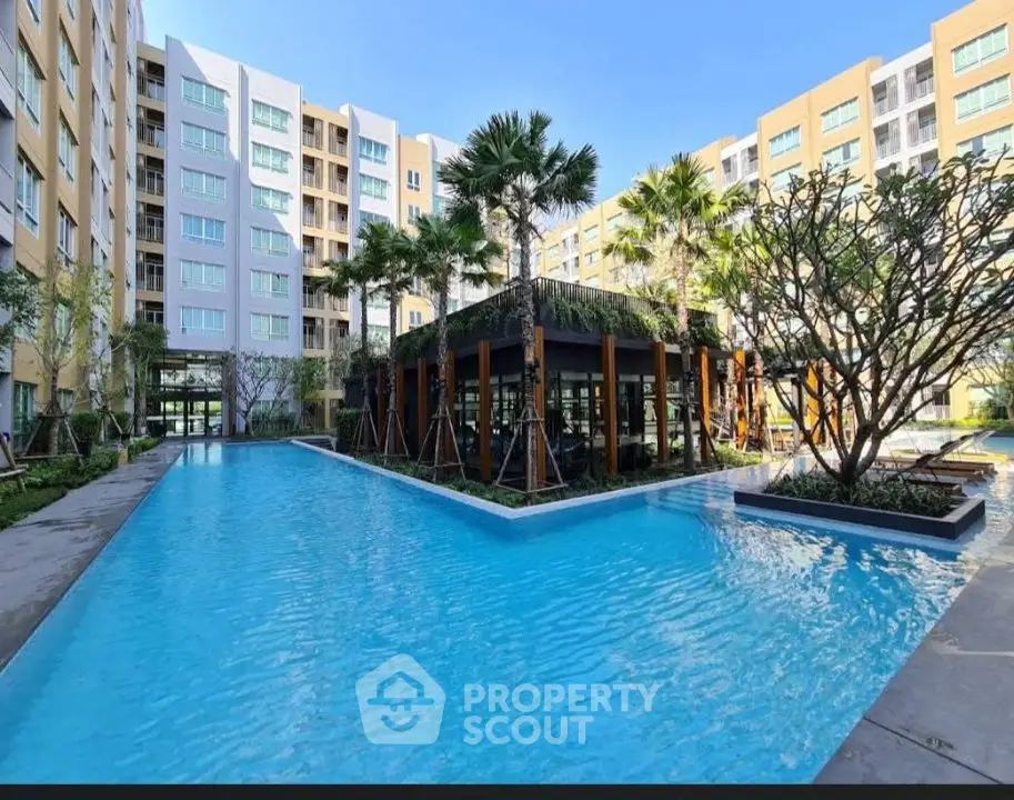 Luxurious apartment complex with stunning pool and lush landscaping