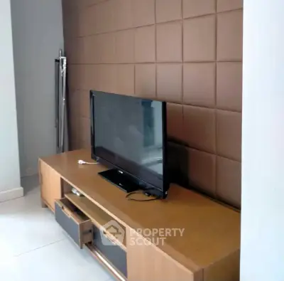 Modern living room with stylish TV stand and wall paneling