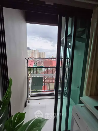 Charming balcony view with cityscape backdrop, perfect for relaxation and enjoying urban living.