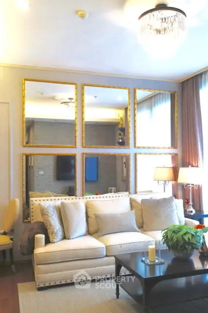 Luxurious living room with elegant decor and plush seating in a modern apartment.