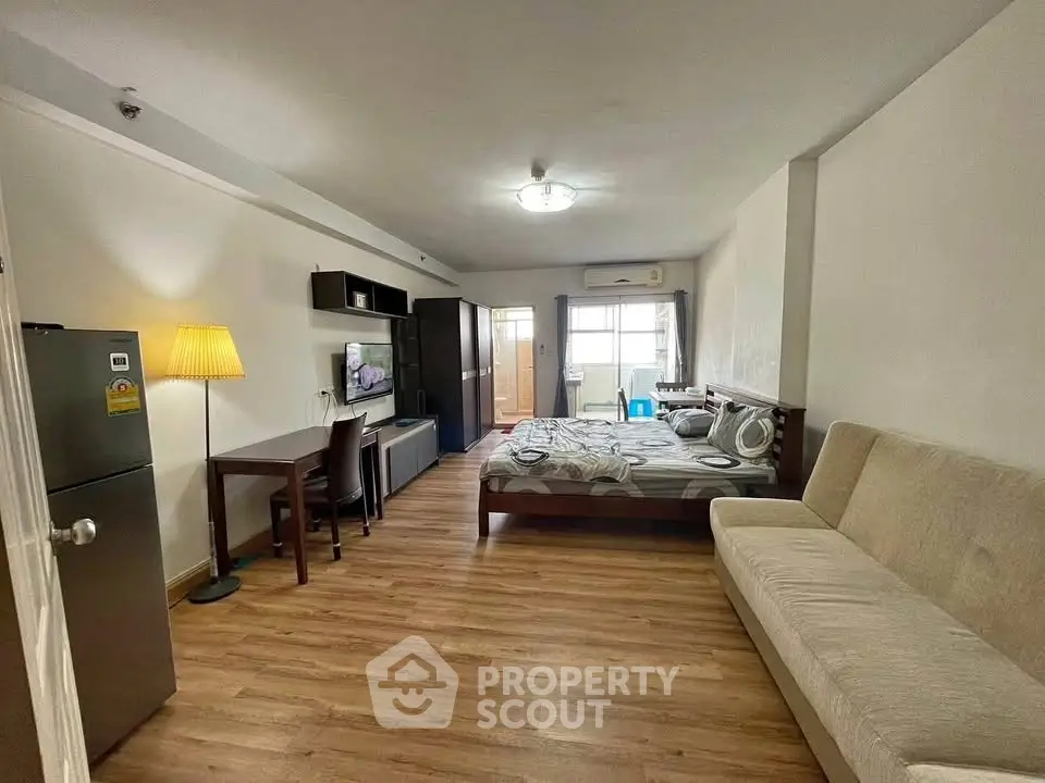 Spacious studio apartment with modern furnishings and natural light