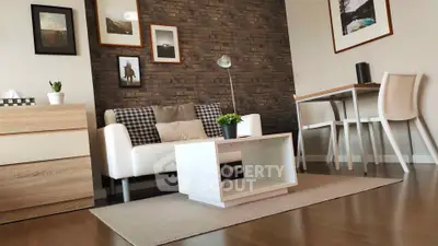Modern living room with stylish decor and cozy seating area, perfect for relaxation and entertaining.