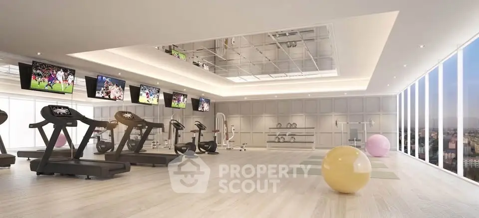Luxurious gym with panoramic city views, modern equipment, and sleek design for an upscale fitness experience.