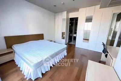 Spacious bedroom with modern design and ample natural light