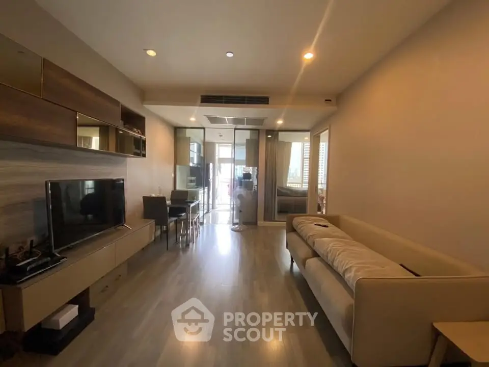 Spacious modern living room with sleek furniture and natural light