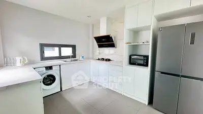 Modern kitchen with sleek appliances and open layout design