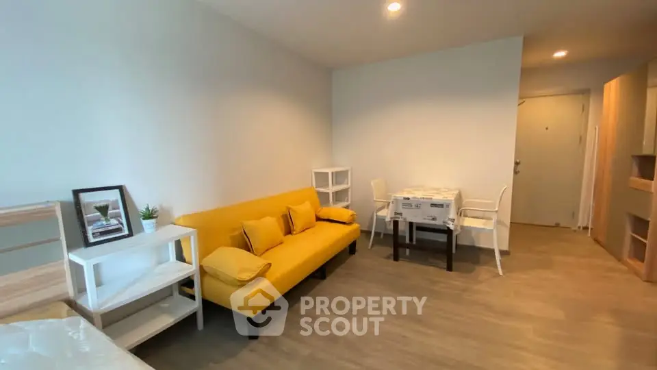 Modern living room with yellow sofa and minimalist decor