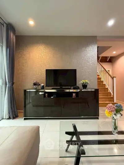Modern living room with stylish decor and sleek TV stand