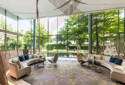 Luxurious modern living room with floor-to-ceiling windows and garden view